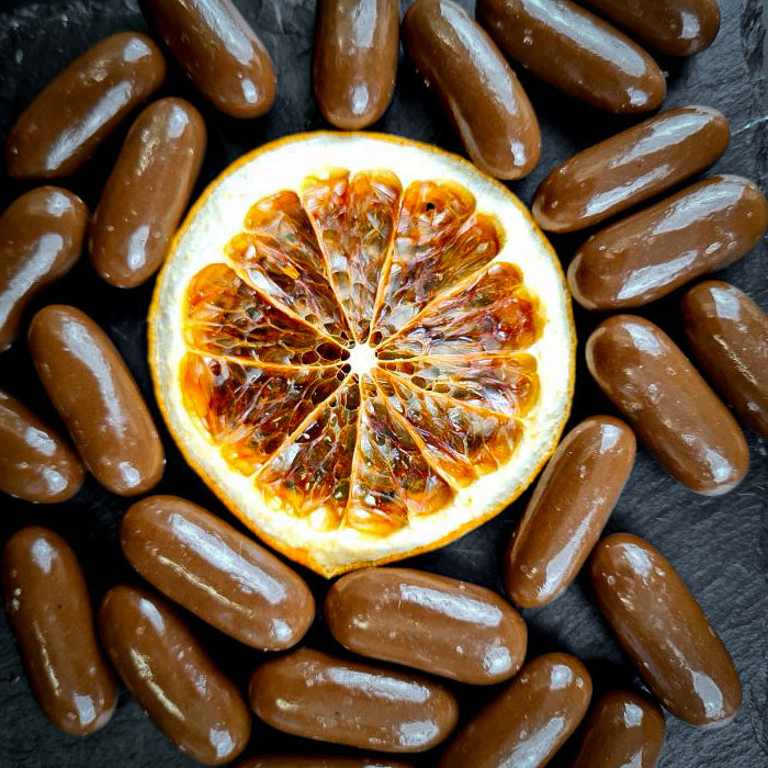 Дражеяс ар апельсину cukātiem piena beļģu šokolādē