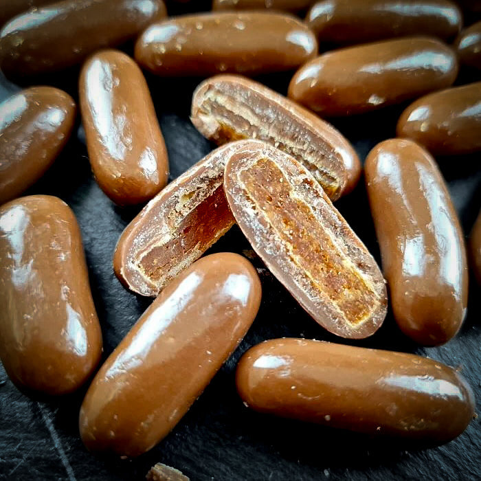 Дражеяс ар апельсину cukātiem piena beļģu šokolādē